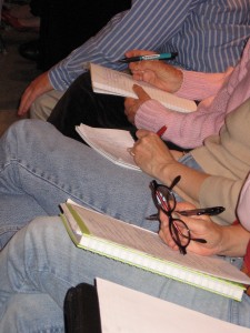 Attendees taking notes at our free elder law seminar.